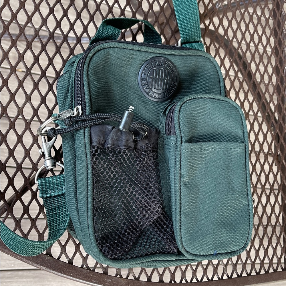 Ricardo Beverly Hills Green Crossbody Bag with 3 zippers and mesh drawstring.